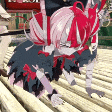 a girl with red hair is crawling on the ground