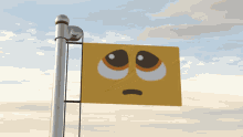 a yellow sign with a sad face on it hangs from a pole