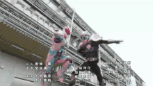 a couple of superheros are standing in front of a building with chinese writing on it
