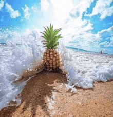 a pineapple is being splashed by a wave on a beach