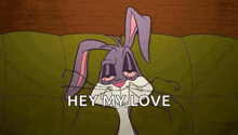 bugs bunny is sitting on a couch with his eyes closed and the words `` hey my love '' written below him .