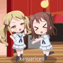 two anime girls are dancing and the word kasuariceo is on the bottom left