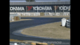 a race track with yokohama written on a wall