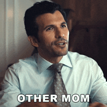 a man in a suit and tie is saying other mom