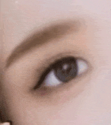 a close up of a woman 's eye with makeup on