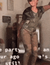 a person is dancing in a room with a blurred background .
