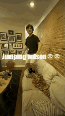 a man is jumping on a couch with the words jumping wilson above him