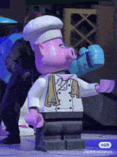 a pink pig wearing a white chef 's hat and a white jacket