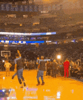 a basketball game is being played in a stadium with a banner that says ' denver ' on it