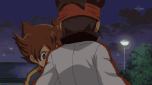 two anime characters are playing with a soccer ball and one has a bandana on