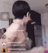 a man without a shirt is standing in a kitchen .