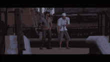two men are dancing in a dark room with a brick wall in the background