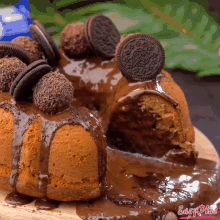a cake with chocolate icing and oreos on top of it