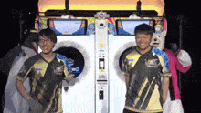 a man in a sega shirt stands next to another man in a sega shirt