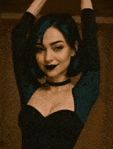 a woman with green hair is wearing a black choker