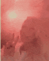 a woman 's hands are visible in a blurry photo behind a glass door