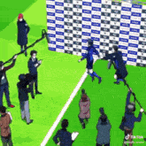 a soccer player is being interviewed by a group of people on the field .