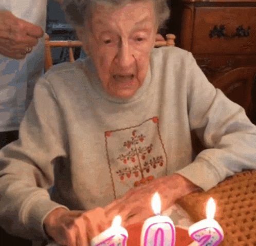 funny blowing out candles gif