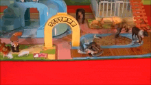 a toy zoo with a yellow archway and animals