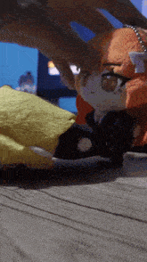 a person playing with a stuffed animal that has a white ribbon on its head