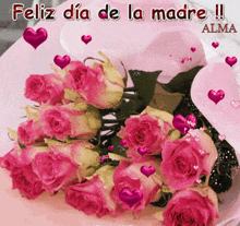 a bouquet of pink roses with hearts and the words feliz dia de la madre on the bottom