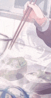 a girl with blue eyes is holding chopsticks and a cup