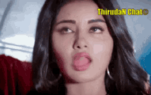 a close up of a woman making a funny face with her tongue sticking out