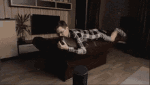 парень лежит на диване падение фейл GIF - Boy Sofa Fall GIFs