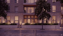 an artist 's impression of a brick building with a tree in front of it