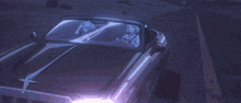 a girl with white hair is sitting in a car with another girl