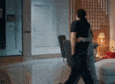 a man and woman hugging in a living room