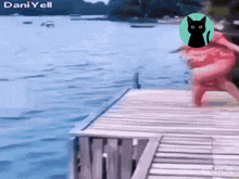 a woman in a red dress is jumping into a lake