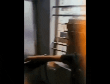 a person is using a drill to fix a window