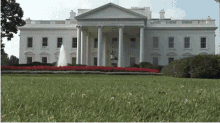 the white house has a fountain in the front