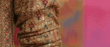 a close up of a person 's hand holding a piece of clothing .