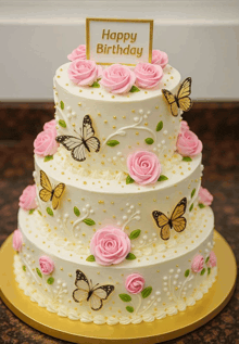 a birthday cake with pink roses and butterflies on it