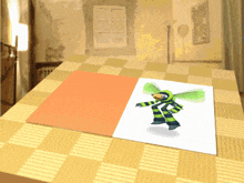 a picture of a dragonfly is sitting on a checkered table cloth
