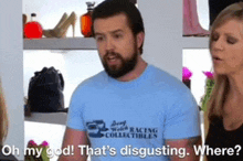 a man wearing a blue shirt that says racing collectibles is talking to a woman