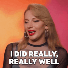 a woman says " i did really really well " while wearing hoop earrings