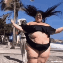 woman dancing shades beach posing
