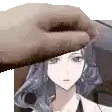 a hand is holding a hat over a woman 's head .