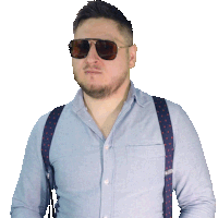 a man wearing suspenders and sunglasses looks serious