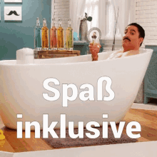 a man is sitting in a bathtub with the words spaß inklusive written below him