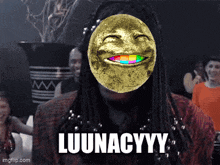 a man with dreadlocks is wearing a gold mask with a rainbow smile and the words luunacyyy on the bottom