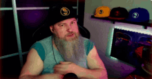 a man with a beard is wearing a hat that says ' sd ' on it