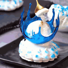 a blue and white dessert with the words mrcakes on the bottom