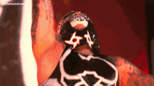 a close up of a wrestler 's face with a mask on his face