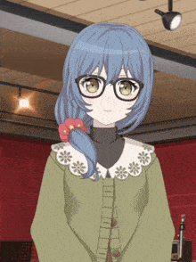a girl with blue hair wearing glasses and a sweater