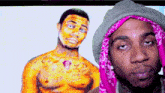a man wearing a pink bandana is standing in front of a drawing of a man