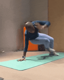 a man is doing a plank on a yoga mat